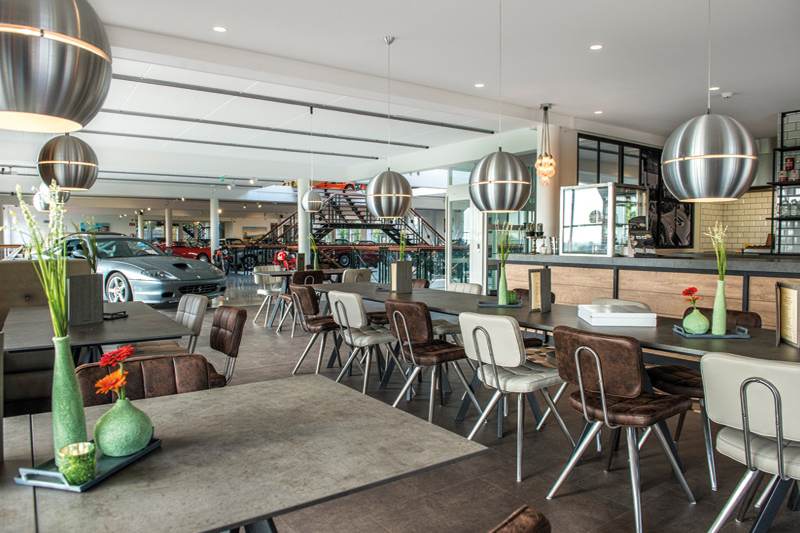 Tables in the Grand Café overlooking the classic car collection.